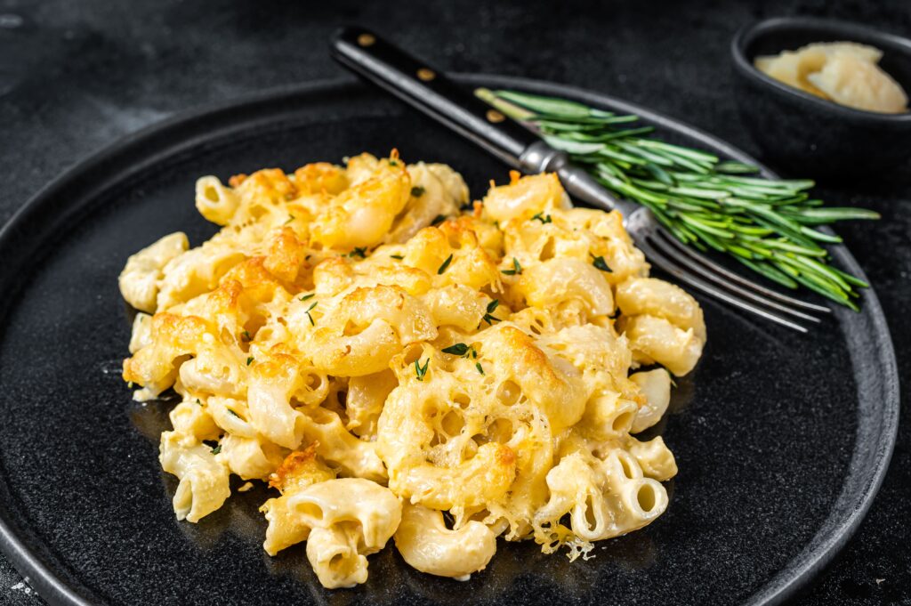 Golden, cheesy mac and cheese featuring cheddar, Gruyère, and Parmesan for the perfect comfort food.