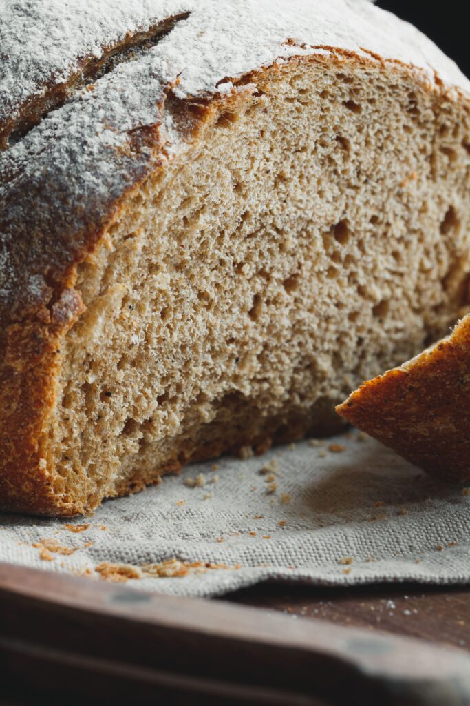 Close-up of artisan Italian bread showcasing its airy crumb and crisp crust.