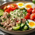 5 types of salad: Classic green salad, Caesar salad, fruit salad, pasta salad, and quinoa salad displayed on a table, offering a variety of healthy and delicious options.